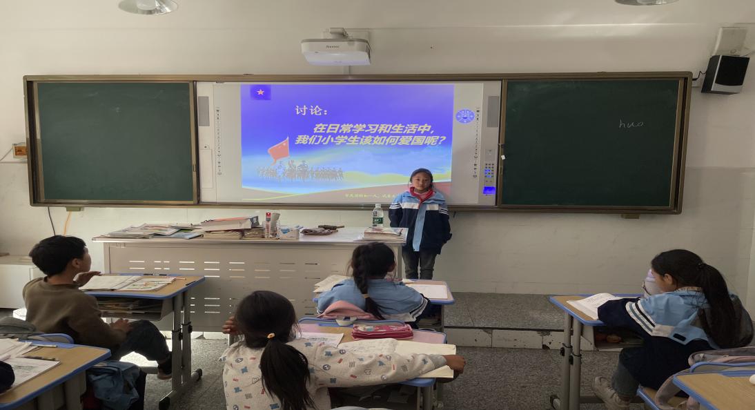 新民小学开展学习实践《爱国主义教育法》实践活动2.jpg